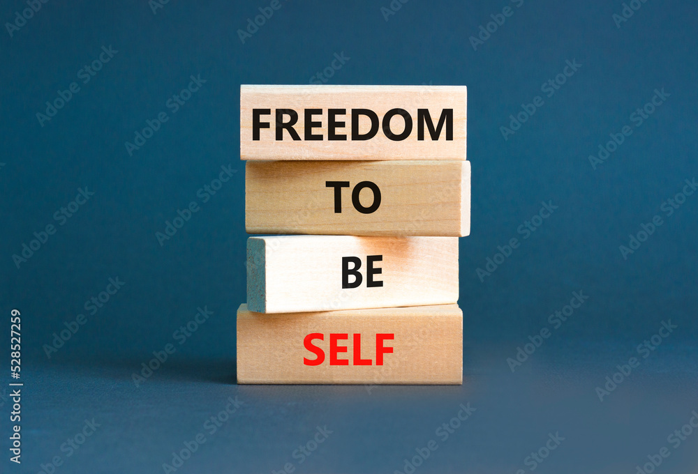 Freedom to be self symbol. Concept words Freedom to be self on wooden blocks on a beautiful grey table grey background. Business, psychological freedom to be self concept. Freedom to be self symbol. Concept words Freedom to be self on wooden blocks on a beautiful grey table grey background. Business, psychological freedom to be self concept.
