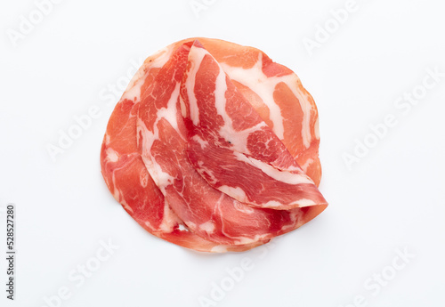 Italian prosciutto crudo or jamon. Raw ham. Isolated on white background.