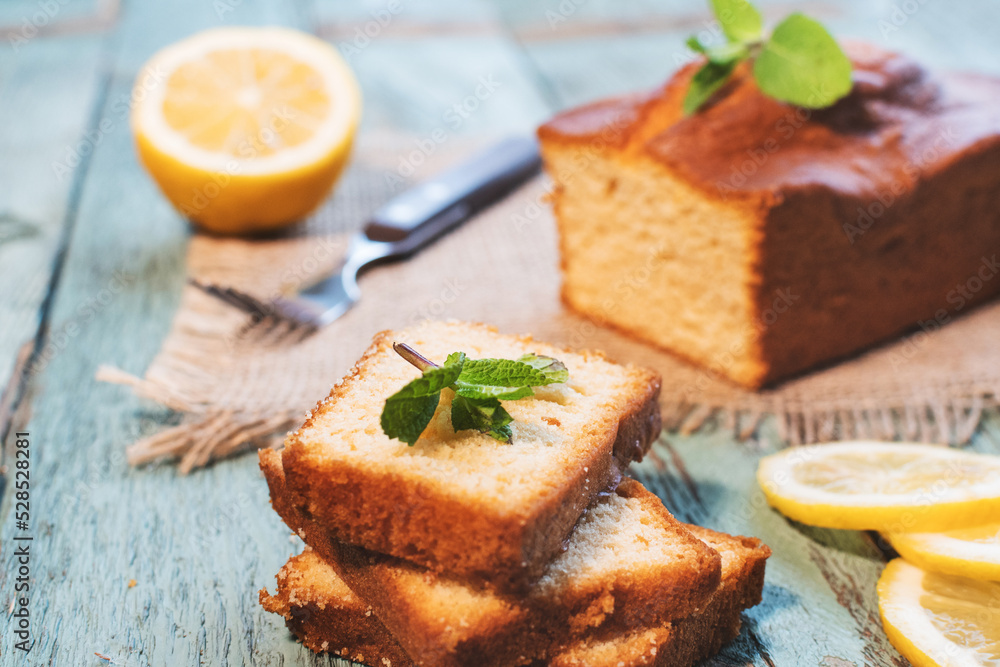 Lemon pound cake on rustic wooden background with lemon. Lemon pound cake on rustic wooden background with lemon.