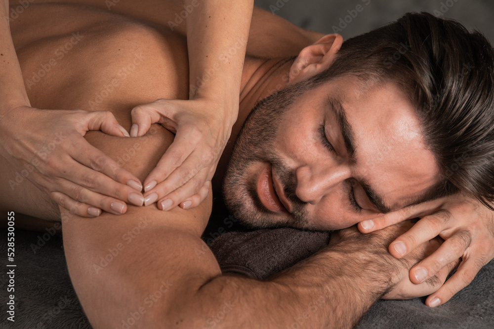 Man getting back massage at spa Man getting back massage at spa