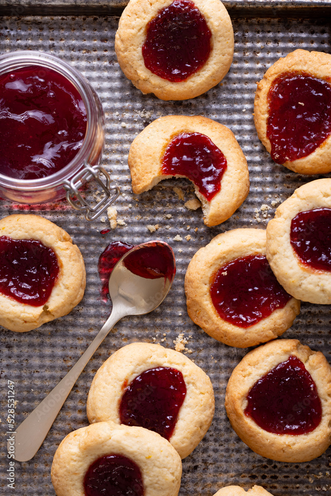 Argentinian traditional cookies called Pepas filled with jam placed on old iron tray