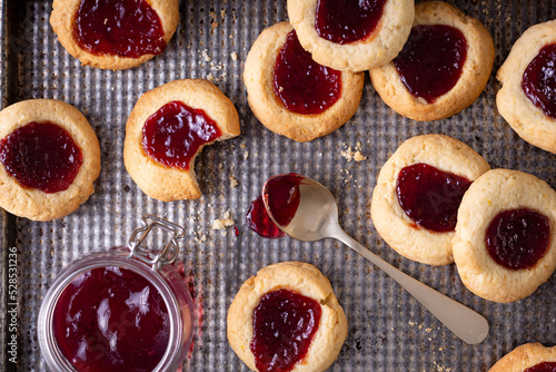 Argentinian traditional cookies called Pepas filled with jam placed on old iron tray photo