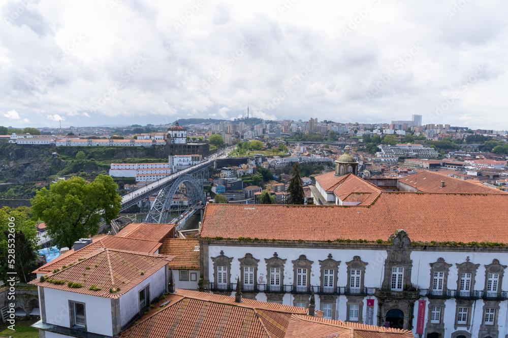 View of the most famous bridge in Porto, from the tower of the cathedral, with the sky full of clouds