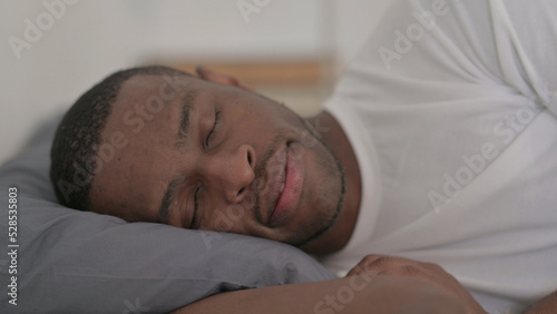 African Man Sleeping in Bed Peacefully