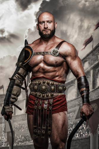 Portrait of arena fighter from ancient rome with naked torso and swords in coliseum.