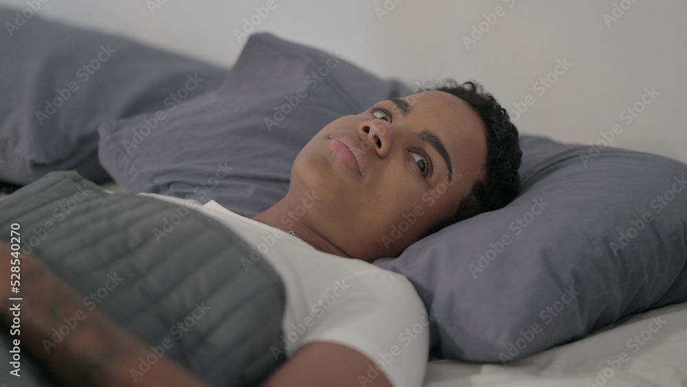 African Woman Awake in Bed Thinking African Woman Awake in Bed Thinking