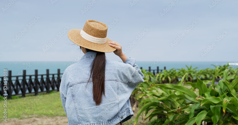 Woman look at the sea in north coast of taiwan