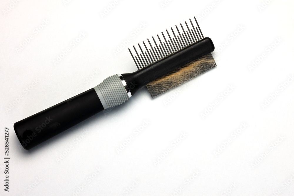 dog fur on a dog comb used for grooming dog fur on a dog comb used for grooming