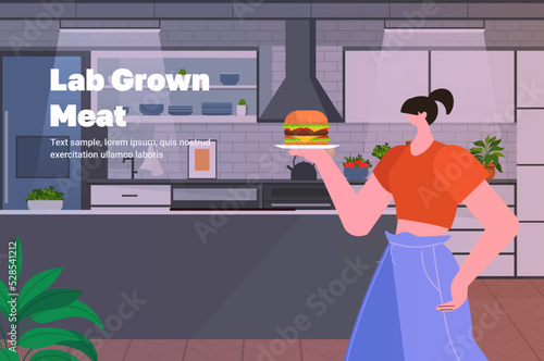 woman holding cultured beef burger made from animal cells artificial lab grown meat production concept