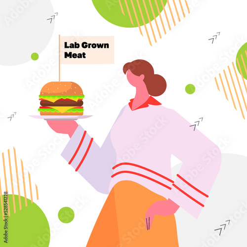 woman holding cultured beef burger made from animal cells artificial lab grown meat production concept