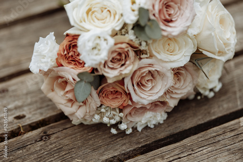Wedding bouquet on wooden texture
