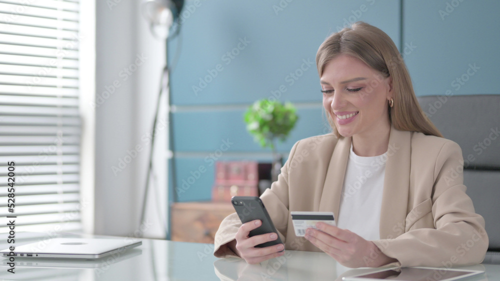 Businesswoman Shopping Online on Smartphone at Work Businesswoman Shopping Online on Smartphone at Work