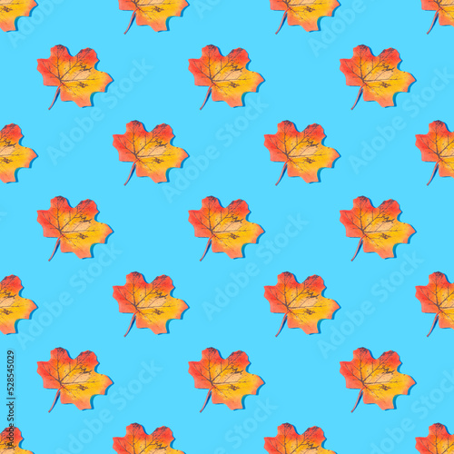 Absolutely seamless pattern of yellow leaves on a blue background