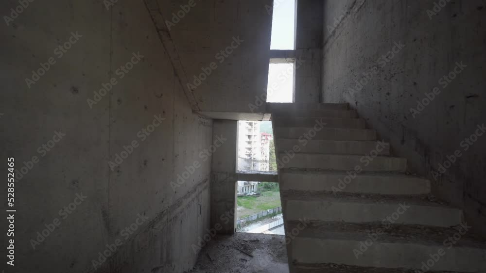 Camera moves around construction site of high building with view of city on sunny day. Apartment building under construction. Developer, real estate investment. concrete monolithic piles. Camera moves around construction site of high building with view of city on sunny day. Apartment building under construction. Developer, real estate investment. concrete monolithic piles.