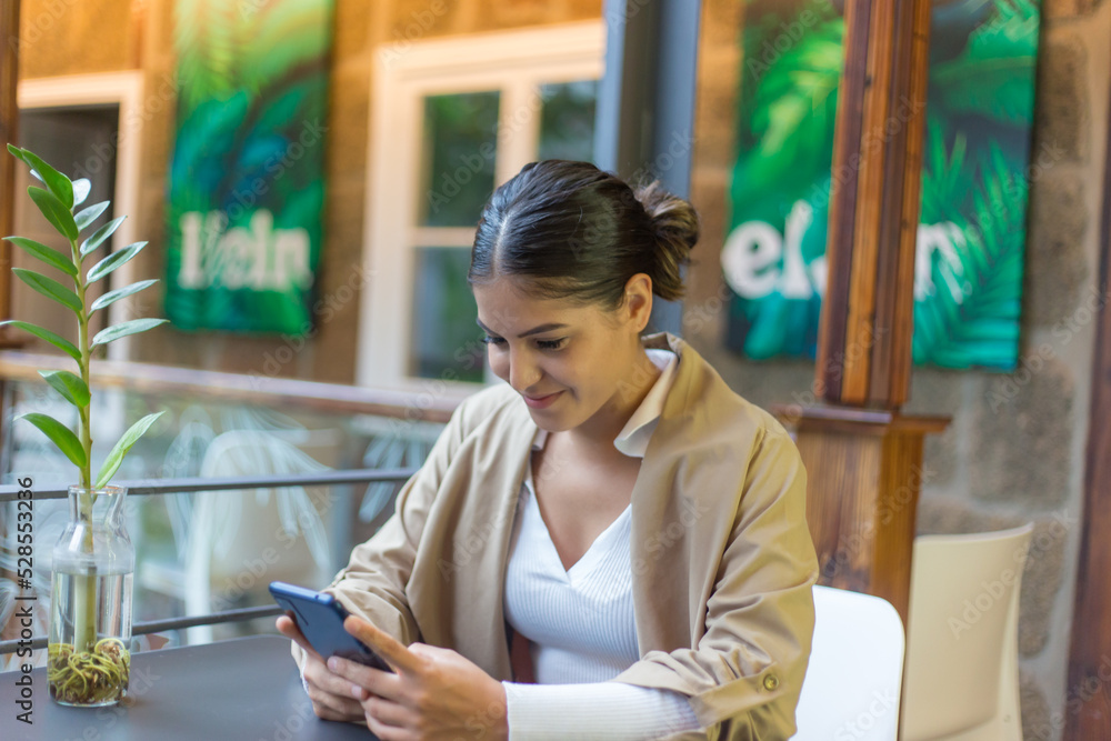 woman using digital tablet in cafe woman using digital tablet in cafe