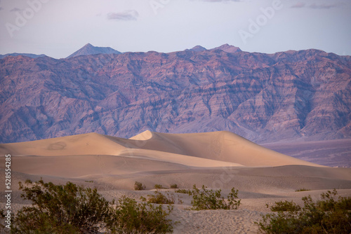 the sand dunes of death valley national park in the sunset