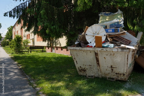 фотографія Large waste container filled with bulky waste, old furniture and other home trash