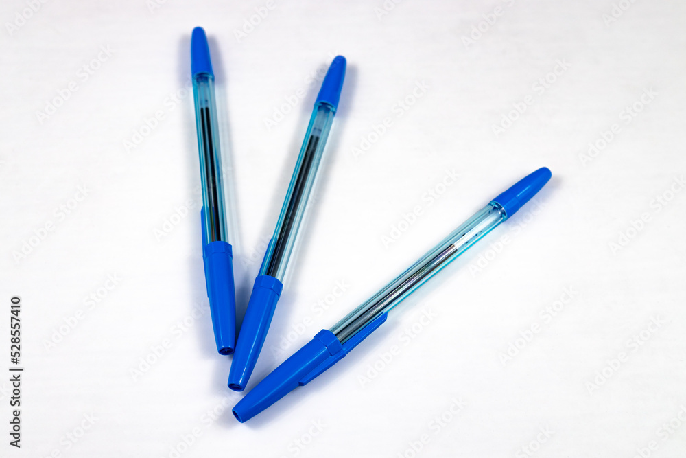 3 ballpoint pens on a white background. close-up, selective focus. 3 ballpoint pens on a white background. close-up, selective focus.
