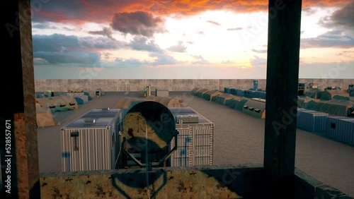 An abandoned and deserted secure military base and army camp in the middle of the desert as viewed from the top of the military base's watchtower. photo