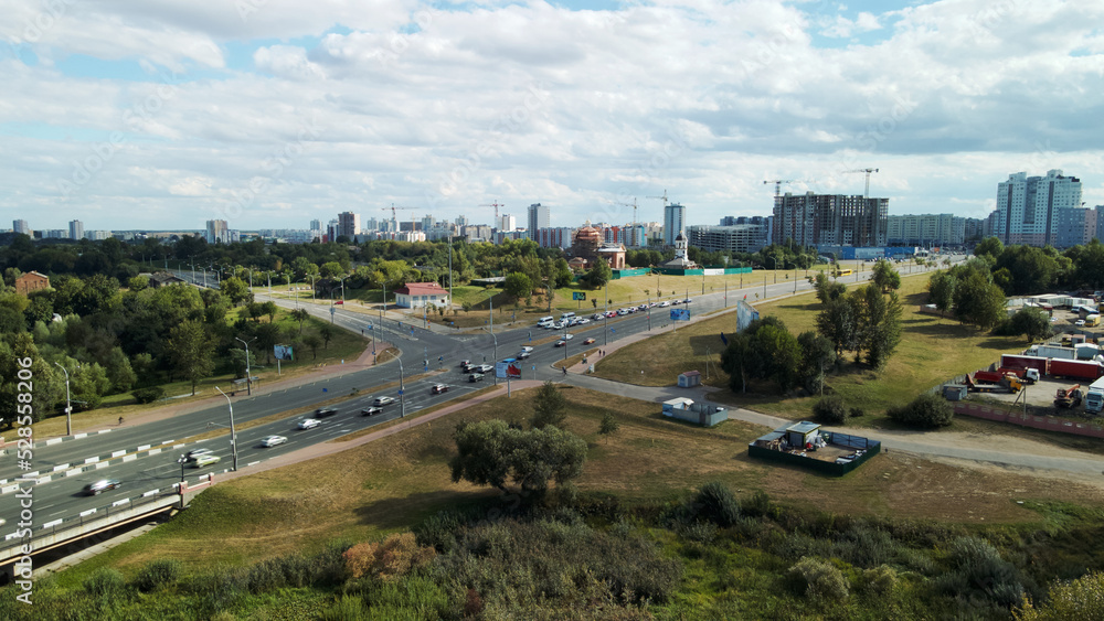 Multi-lane city highway. Multi-storey buildings in the suburbs. Aerial photography. Multi-lane city highway. Multi-storey buildings in the suburbs. Aerial photography.