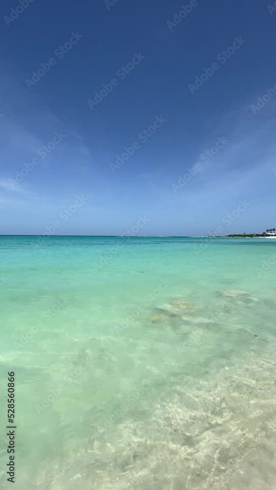 Cell phone video on the shore of the caribbean sea. My shadow reflected in the white sand and the turquoise waters of the sea. vacation concept Cell phone video on the shore of the caribbean sea. My shadow reflected in the white sand and the turquoise waters of the sea. vacation concept