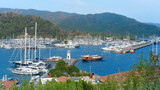 Sea port with yachts. View of the marina of Marmaris with the masts of pleasure ships. Turkey, summer, beach vacation.
