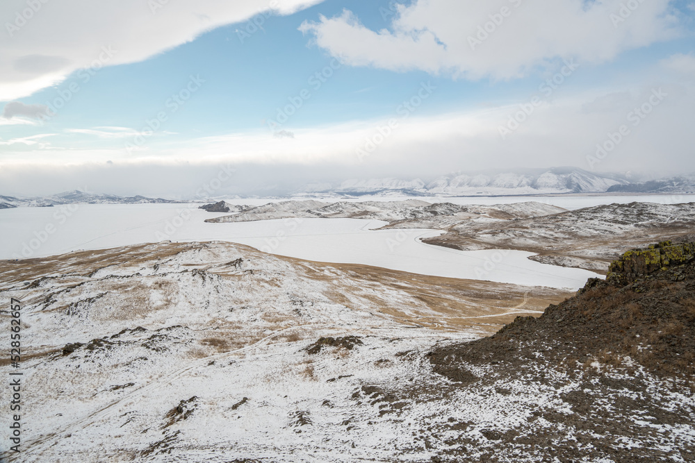 landscape with snow and mountains on lake Baikal landscape with snow and mountains on lake Baikal
