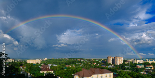 Beautiful bright double rainbow over the small city © Антон Курашенко