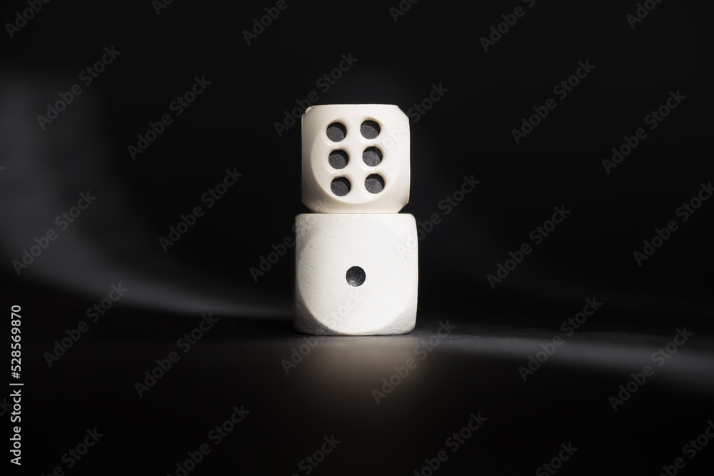 Two dices with number one and number six. Minimum and maximum. Cubes placed one on top of the other. Good luck in casino games. Creative concept of the opposites. Two dices with number one and number six. Minimum and maximum. Cubes placed one on top of the other. Good luck in casino games. Creative concept of the opposites.