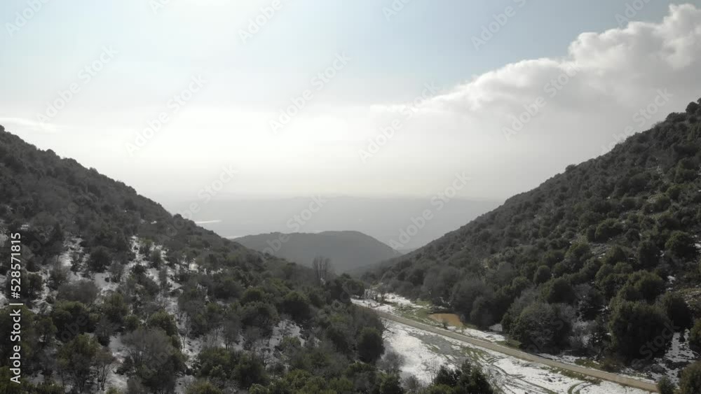 Oak Forest and mounatin with snow, aerial, Israel
Snow covered limestone mountain foothills, drone view, 2021
Oak Forest and mounatin with snow, aerial, Israel
Snow covered limestone mountain foothills, drone view, 2021
