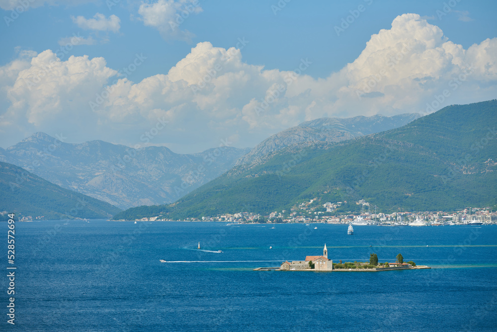 Seascape with female monastery of Gospa od milosrda on an island in Montenegro