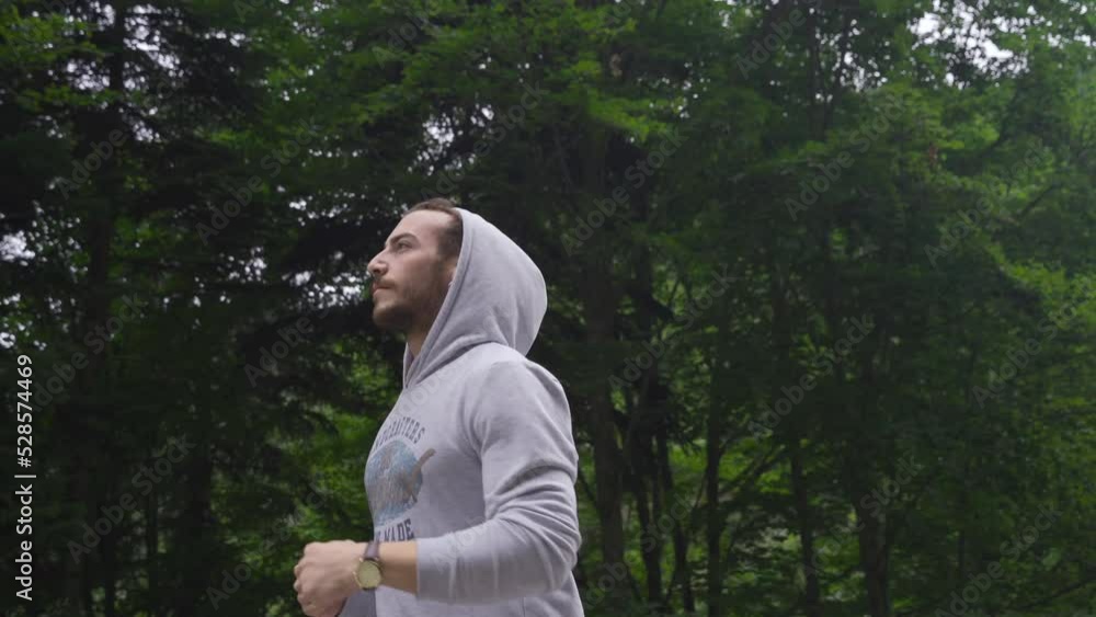 Man jogging in the morning.
He does morning exercise in the forest.
Man jogging in the morning.
He does morning exercise in the forest.