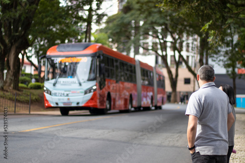 Man looking at curitiba bus. Curitiba 04-22-2022 photo