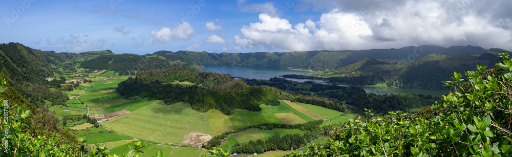 Huge landscape panorama photo of enormous green natural fields with lakes, mountains and forest in countryside of são miguel island, azores, açores, portugal Huge landscape panorama photo of enormous green natural fields with lakes, mountains and forest in countryside of são miguel island, azores, açores, portugal