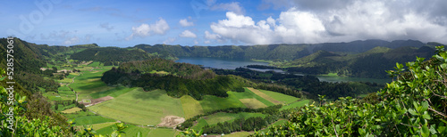 Huge landscape panorama photo of enormous green natural fields with lakes, mountains and forest in countryside of são miguel island, azores, açores, portugal