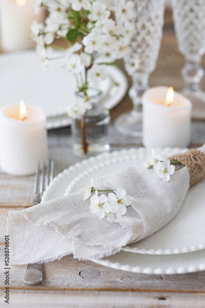 Rustic zero waste wedding decor with natural elements. Wooden table, candles, linen napkins, branches with green leaves. Eco-friendly decoration for the special dinner. Romantic and cozy place Rustic zero waste wedding decor with natural elements. Wooden table, candles, linen napkins, branches with green leaves. Eco-friendly decoration for the special dinner. Romantic and cozy place