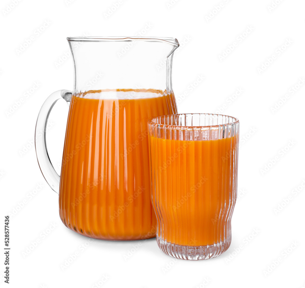 Fresh carrot juice in jug and glass isolated on white Fresh carrot juice in jug and glass isolated on white