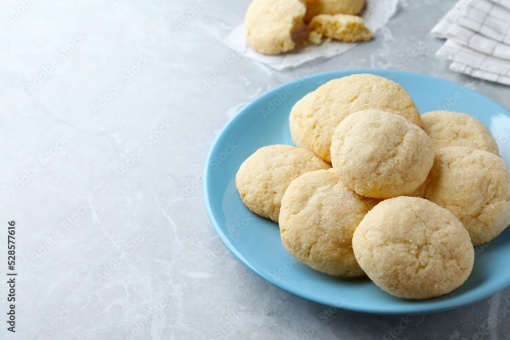 Delicious sugar cookies on light grey marble table, space for text Delicious sugar cookies on light grey marble table, space for text
