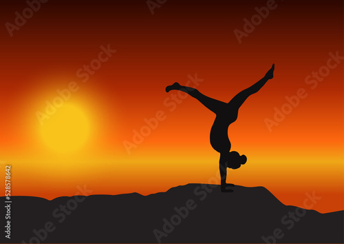 silhouette of a yoga girl at sunset