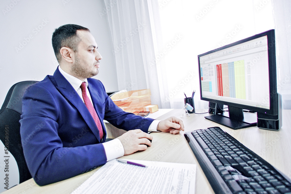 View to profile of working process of a businessman. View to profile of working process of a businessman.