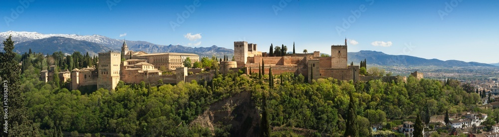 Panorama view of Alhambra with Sierra Navada inthe background, in Granada,  Spain.