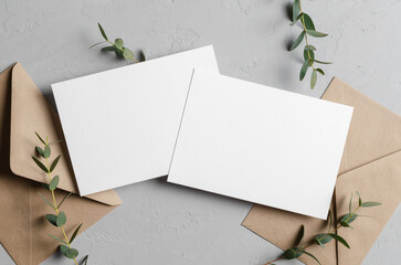 Wedding invitation card mockup with envelopes and eucalyptus, front and back sides