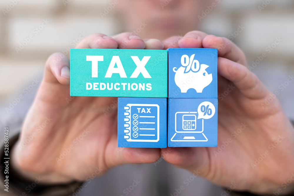 Concept of tax deductions. Taxes deductible plan. Deduction, return of fees. ภาพถ่ายสต็อก
