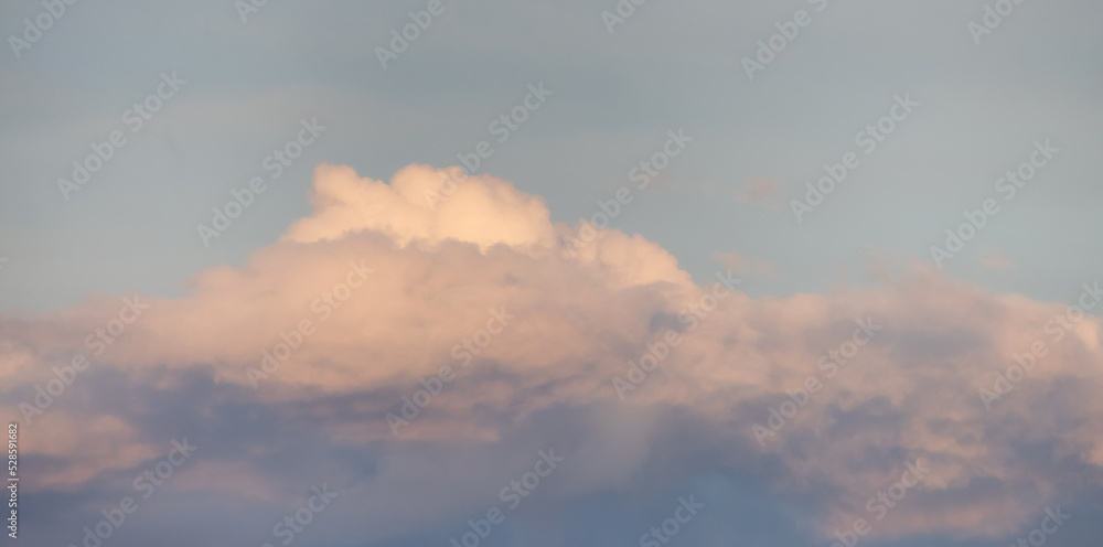 Puff Clouds in the Sky during sunset. Zoom in. Cloudscape Background. British Columbia, Canada. Puff Clouds in the Sky during sunset. Zoom in. Cloudscape Background. British Columbia, Canada.