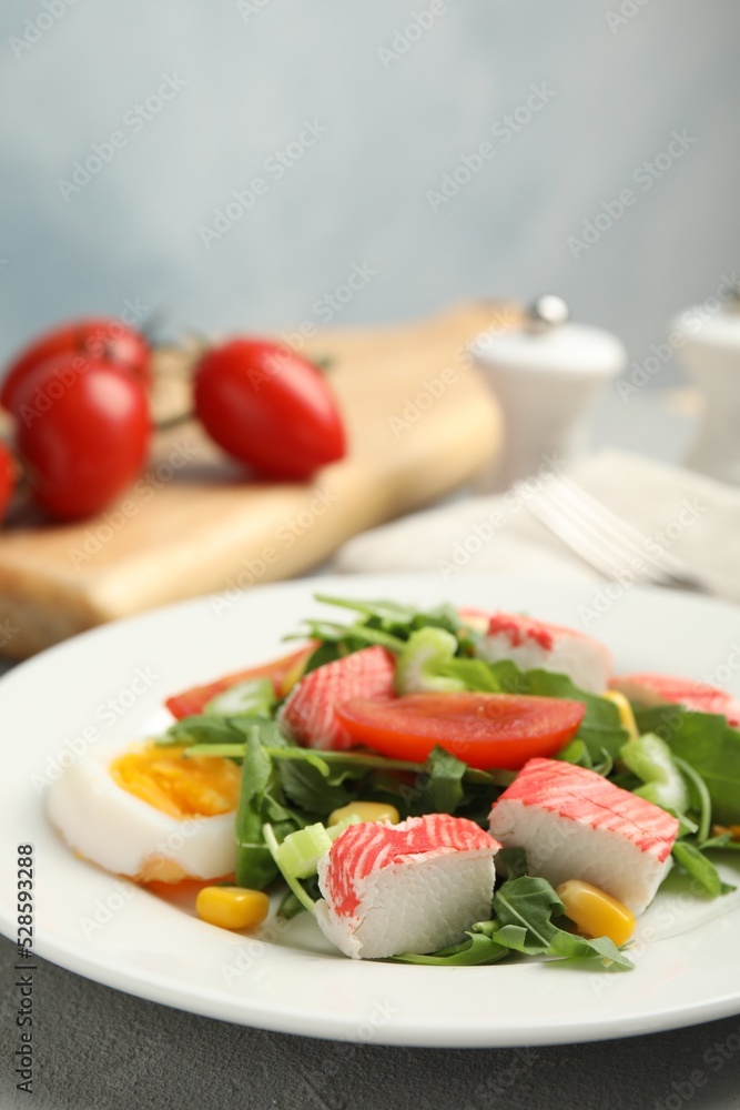 Delicious crab stick salad served on table, closeup Delicious crab stick salad served on table, closeup