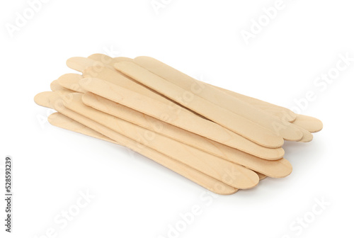 Disposable wooden spatulas for depilatory wax on white background © New Africa