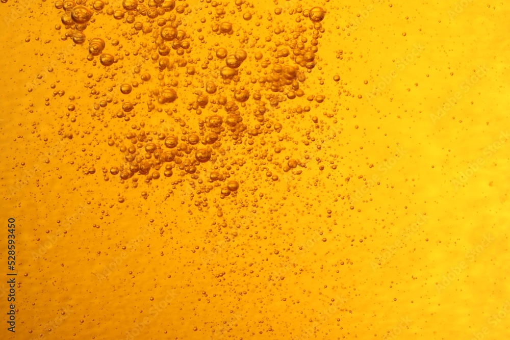 Tasty beer with bubbles as background, closeup Tasty beer with bubbles as background, closeup