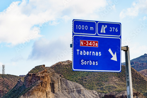 Tabernas desert landscape and road sign, Spain