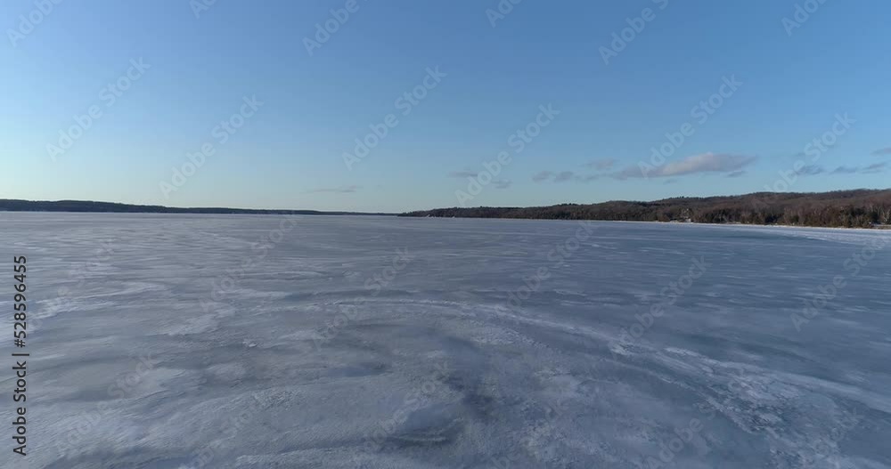 Aerial shot of cold frozen Torch lake landscape in Northern Michigan. Aerial shot of cold frozen Torch lake landscape in Northern Michigan.