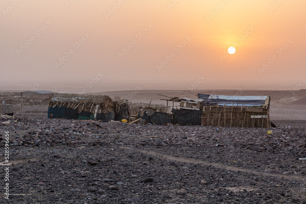 Early morning in Hamed Ela, Afar tribe settlement in the Danakil depression, Ethiopia. Early morning in Hamed Ela, Afar tribe settlement in the Danakil depression, Ethiopia.